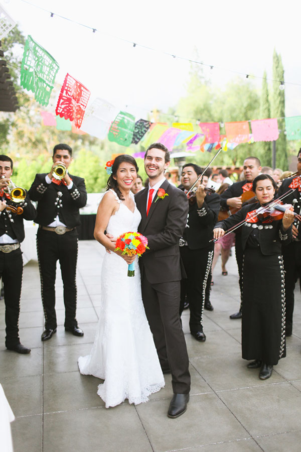 Love the band and flags at this mexican themed wedding