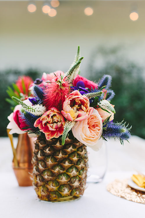 Beautiful Pineapple Centerpiece- Love the flowers! - See More Lovely Pineapple Party Ideas At B. Lovely Events!
